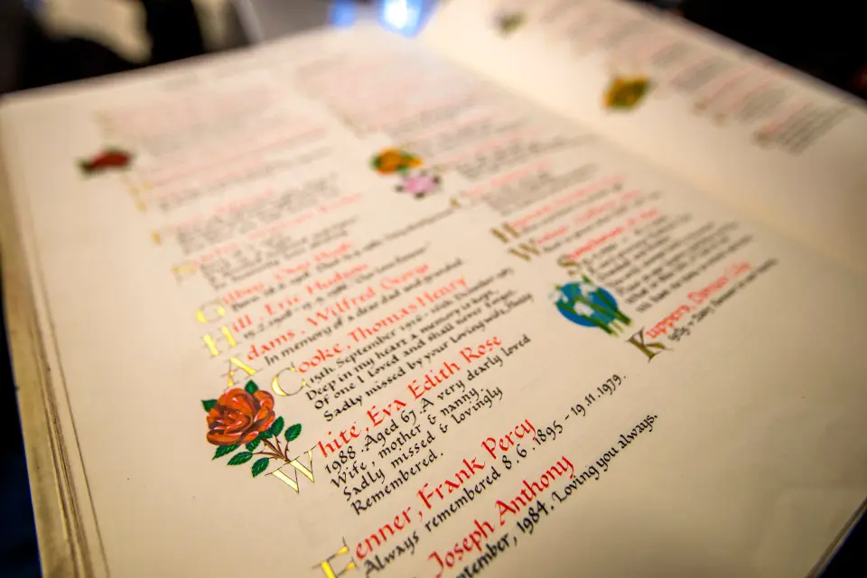 Page from Book of Remembrance, featuring hand written memorials