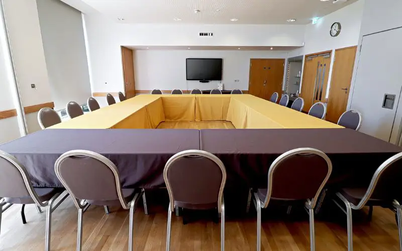 The Wells Suite set up with tables formed into a square.