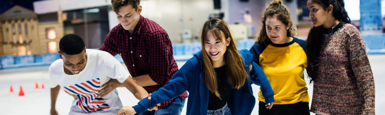 Group of young people ice skating