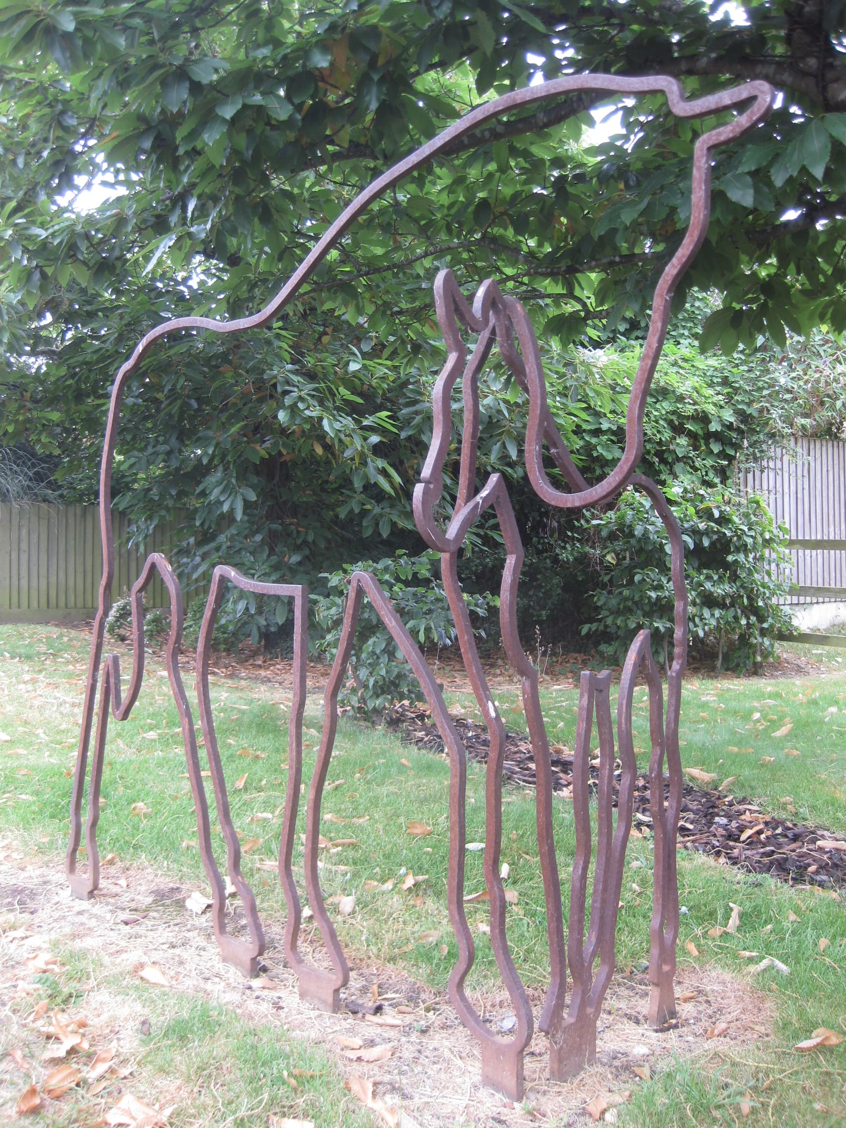Metal sculpture of outline of horses