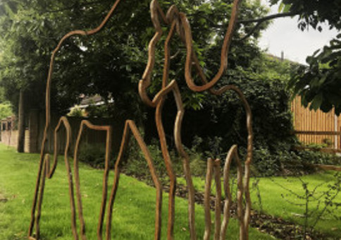 Metal sculpture of outline of horses