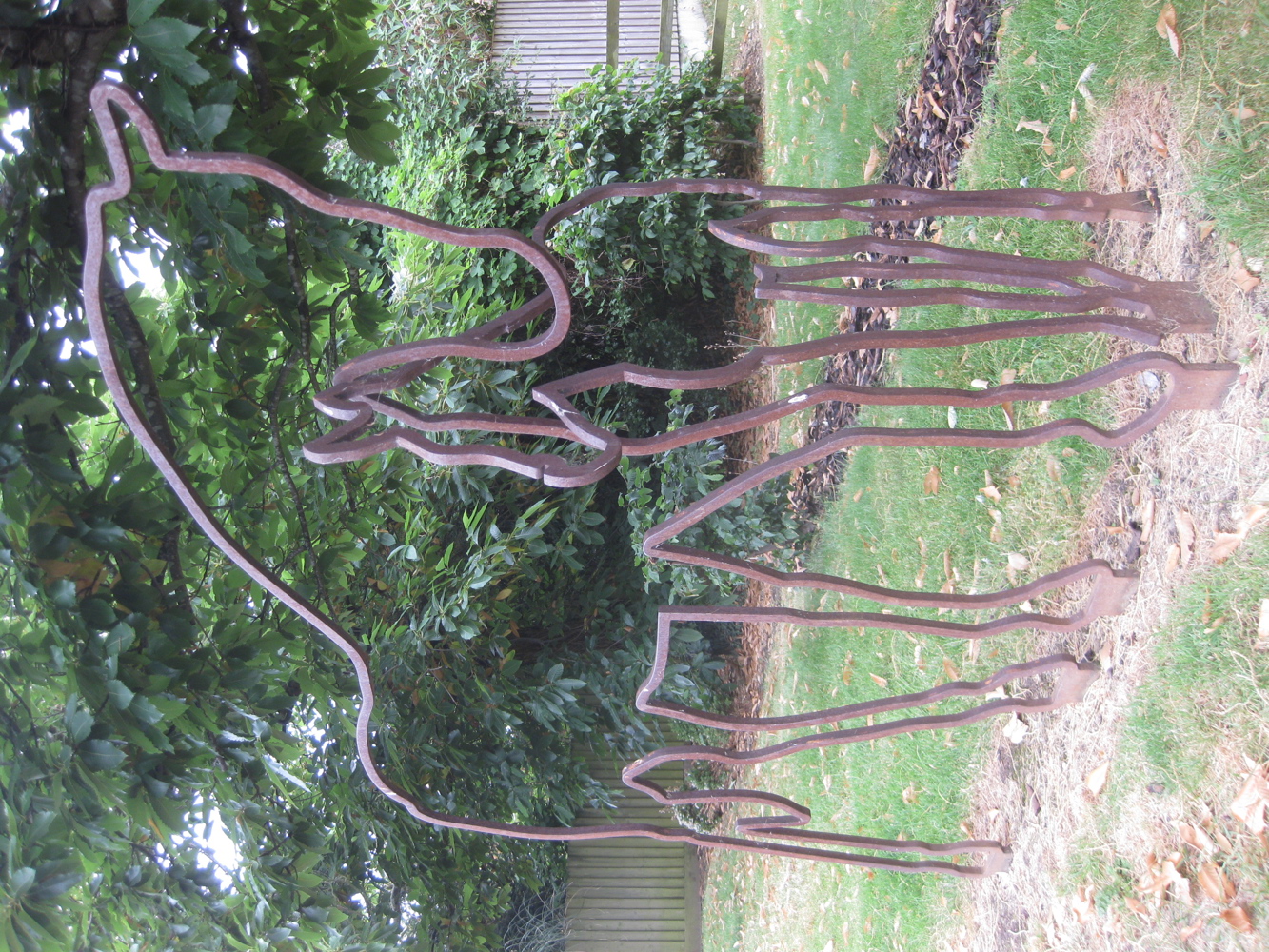 Metal sculpture of outline of horses