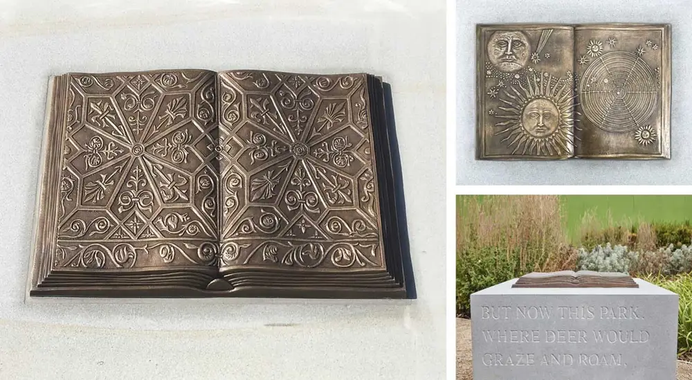 Bronze statue of book on a plinth, engraved with 'But now this park where deer would graze and roam'
