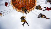 People riding chairoplanes preview