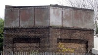 Brick tower with metal top behind metal railings (Photograph courtesy and copyright © Stuart Axe) preview