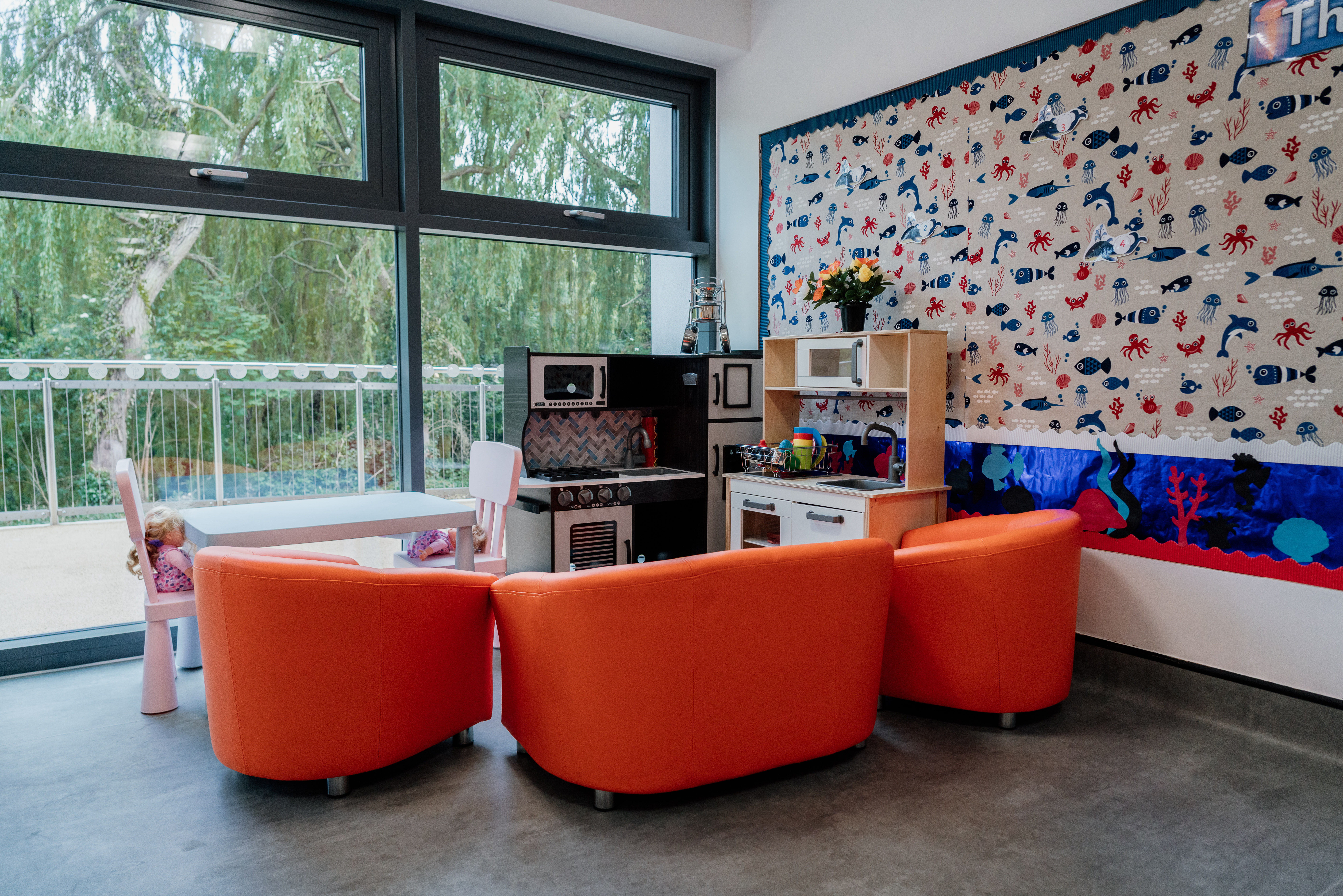 Kitchen play area with orange seating preview