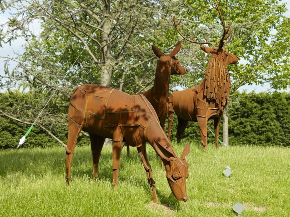 Three statues of deer