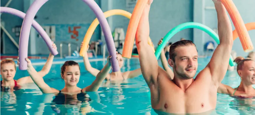People in a swimming pool doing aqua aerobics