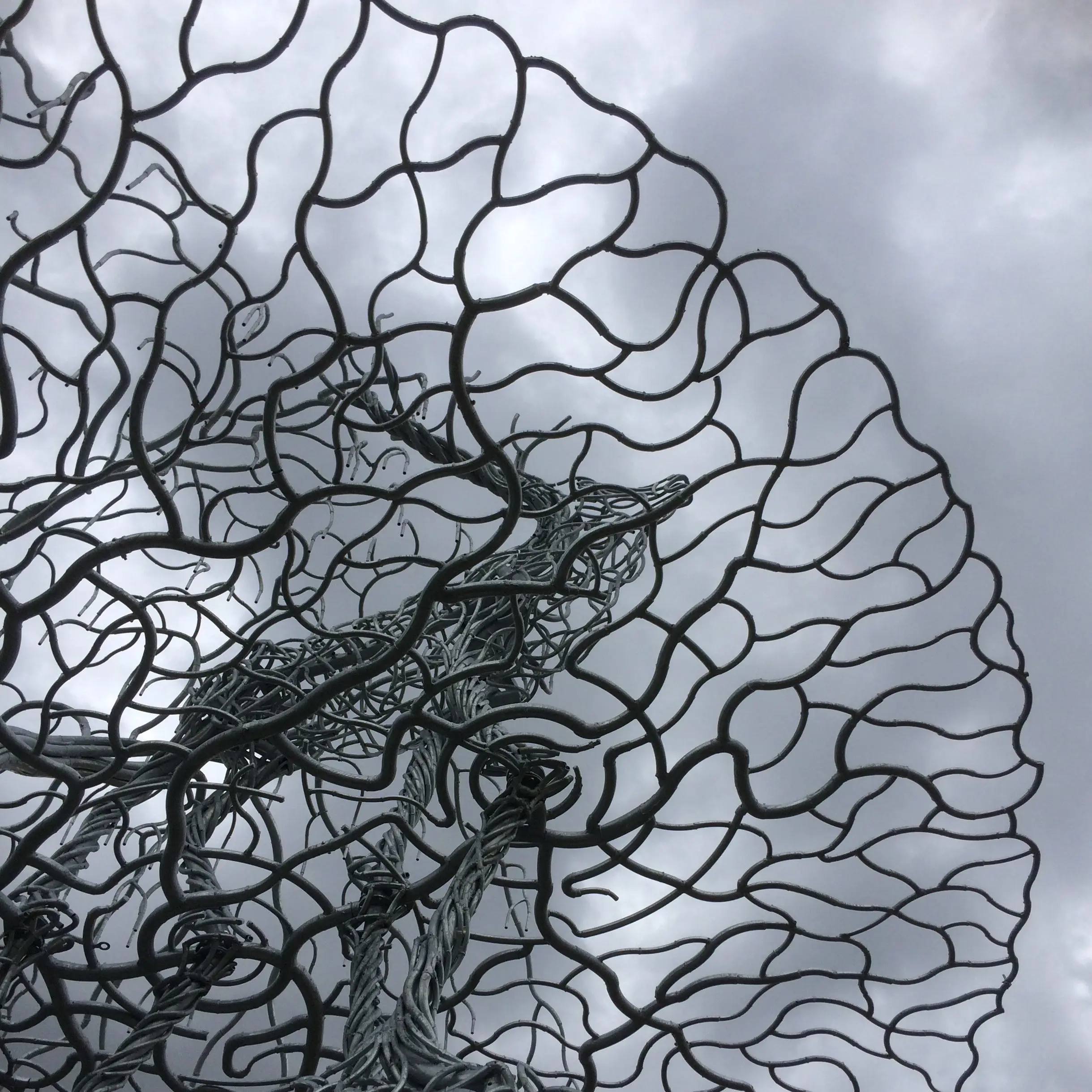 Metal sculpture of stag on a crown-shaped base