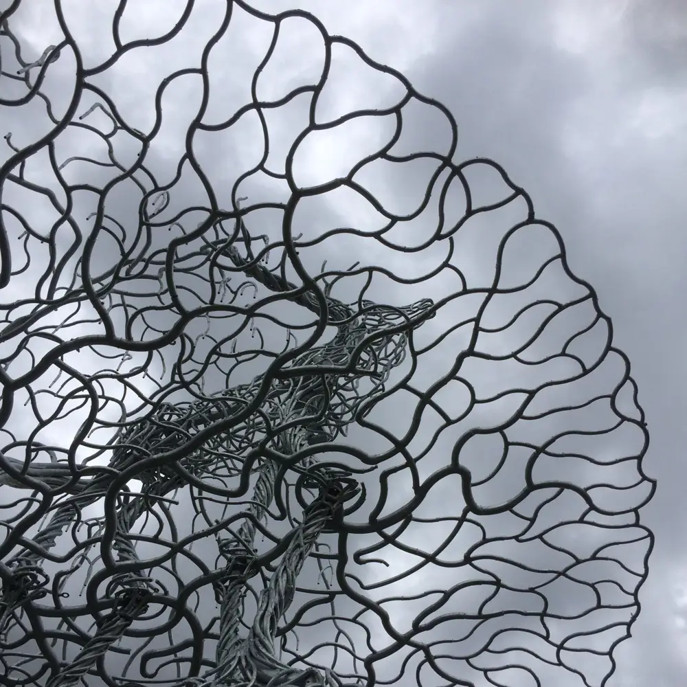 Metal sculpture of stag on a crown-shaped base