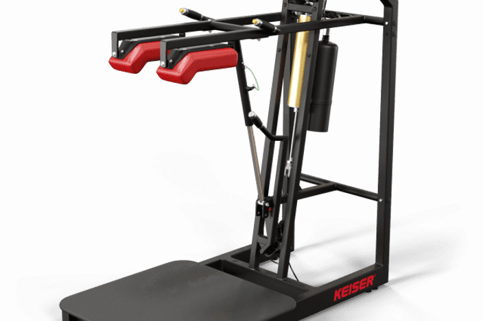 A standing platform with padded shoulder rests providing resistance to your squats, and a screen to track progress.