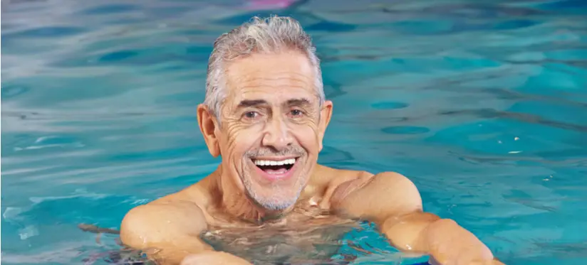 Smiling older man in swimming pool