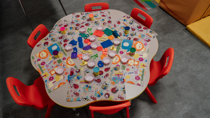 Small round table laid out for craft activity