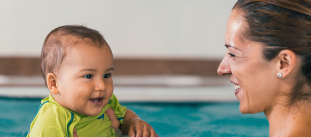 Mother and baby in swimming pool